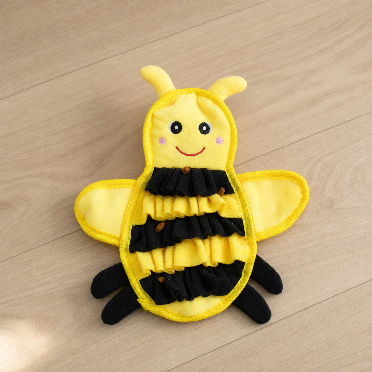 Busy Bee Crinkle Snuffle Mat with treats tucked in the fleece
