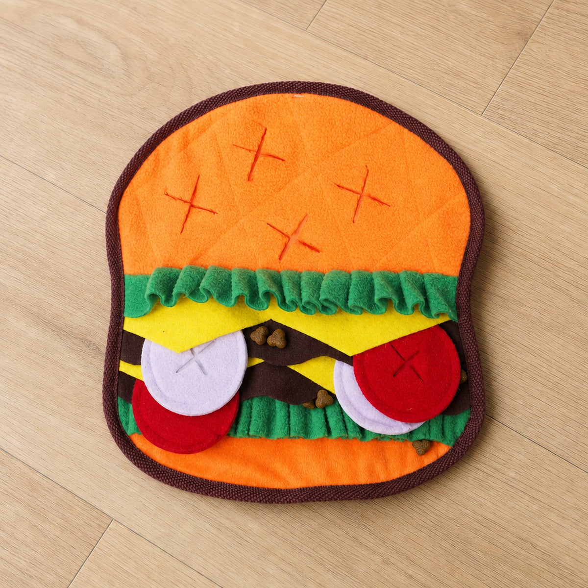 Burger Crinkle Snuffle Mat with treats tucked in the fleece